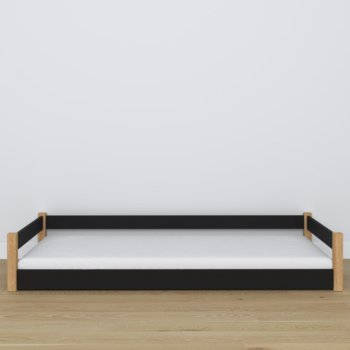Letto basso in legno nero-quercia – cornice bassa, vista laterale, camera da letto stile scandi